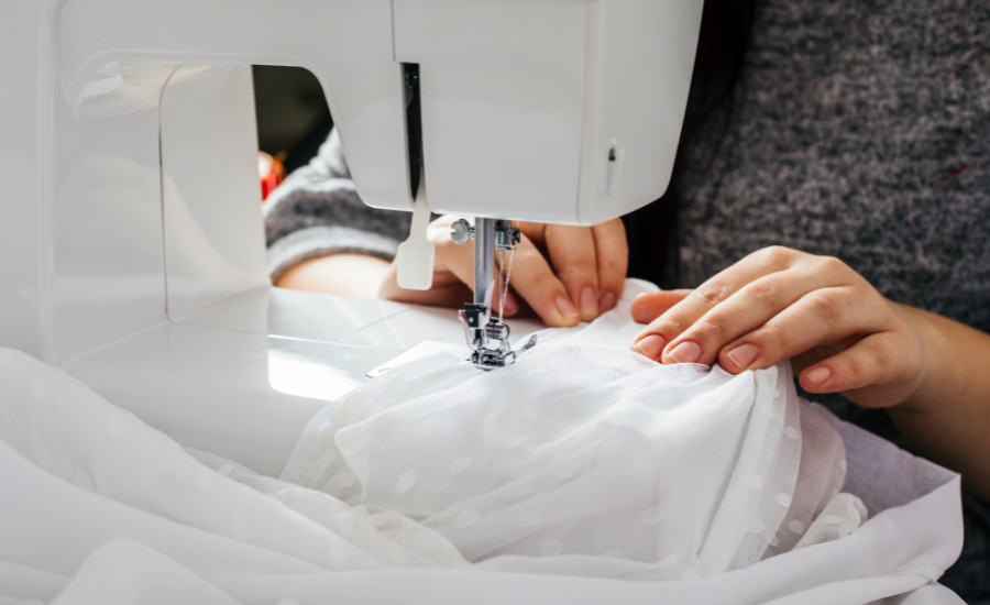 a person hemming a dress